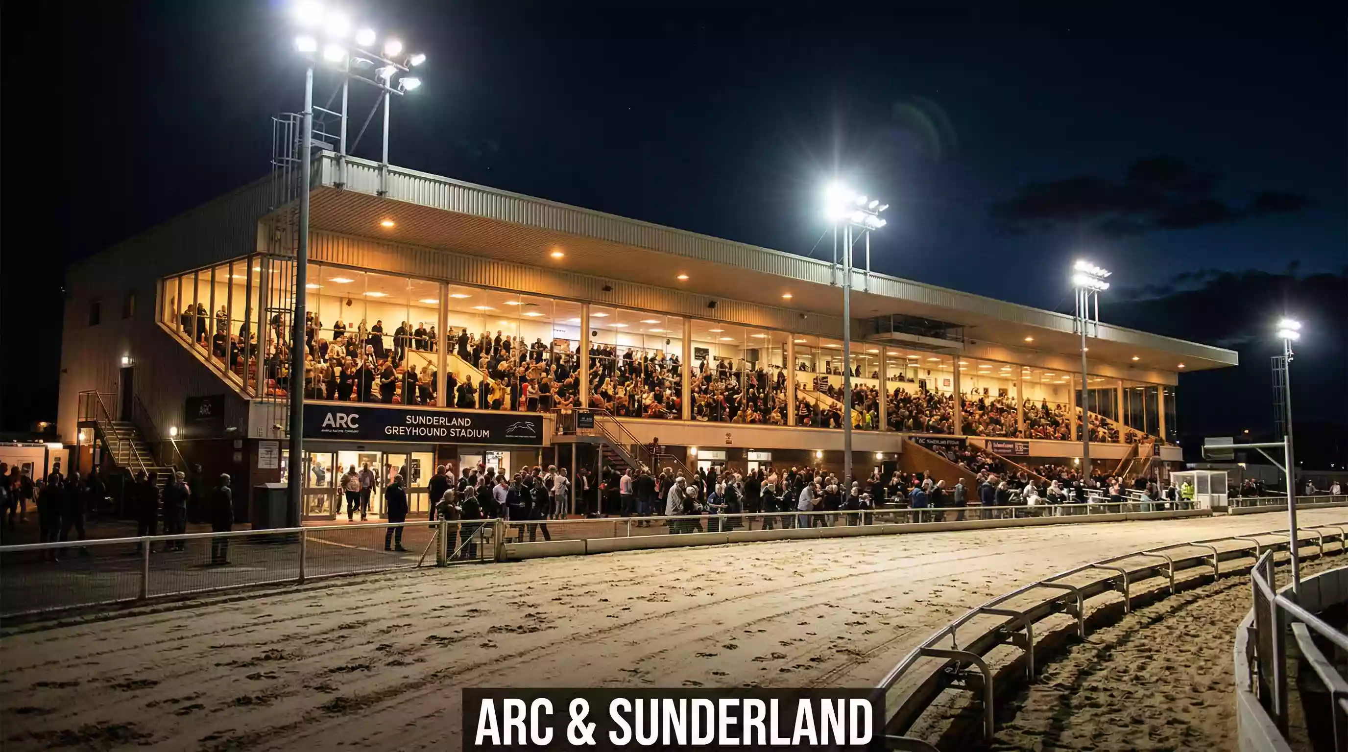 Sunderland greyhound stadium grandstand with ARC branding visible on a race night