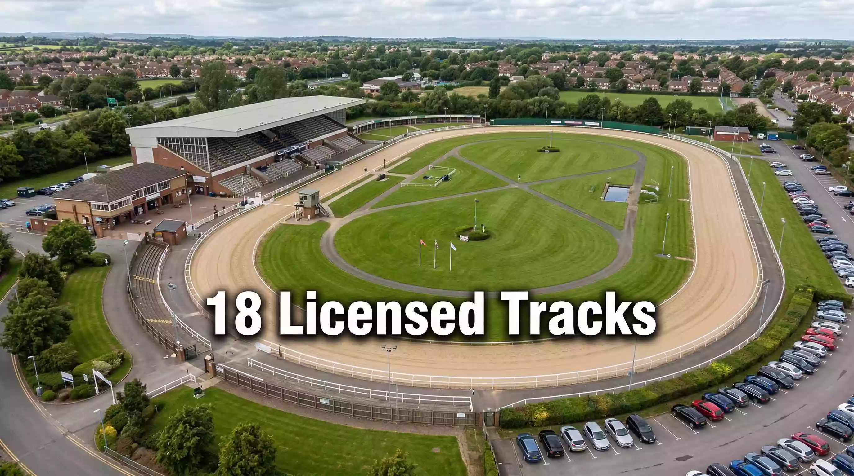 Aerial view of a UK greyhound racing stadium with an oval sand track